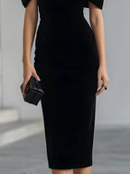 Robe midi spectaculaire en velours noir avec nœud
