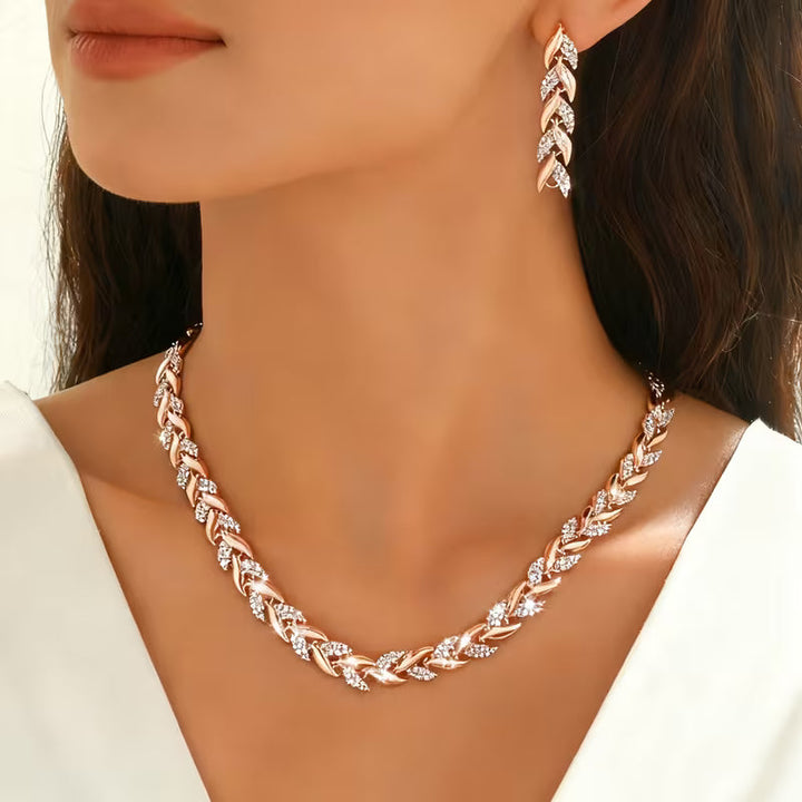 Conjunto de pendientes y pulsera con cadena de hojas en oro rosa  