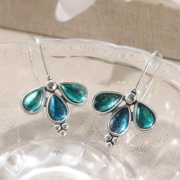 Pendientes artesanales colgantes de vidrio verde azulado con flores