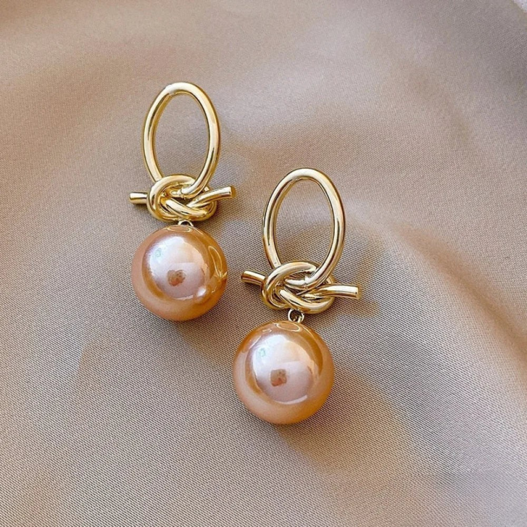 Pendientes colgantes elegantes de perla  