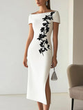 Audrey | Look com vestido midi elegante, decote canoa e estampa floral