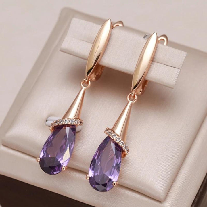 Pendientes de circonita púrpura en oro  