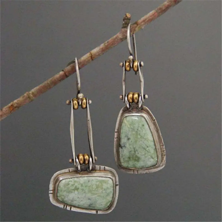 Pendientes colgantes artesanales de plata con turquesa