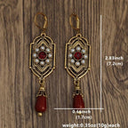 Brincos de gota art déco com granada dourada e pérolas
