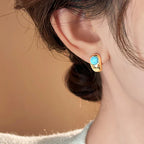 Boucles d’oreilles intemporelles en cuivre courbé et turquoise