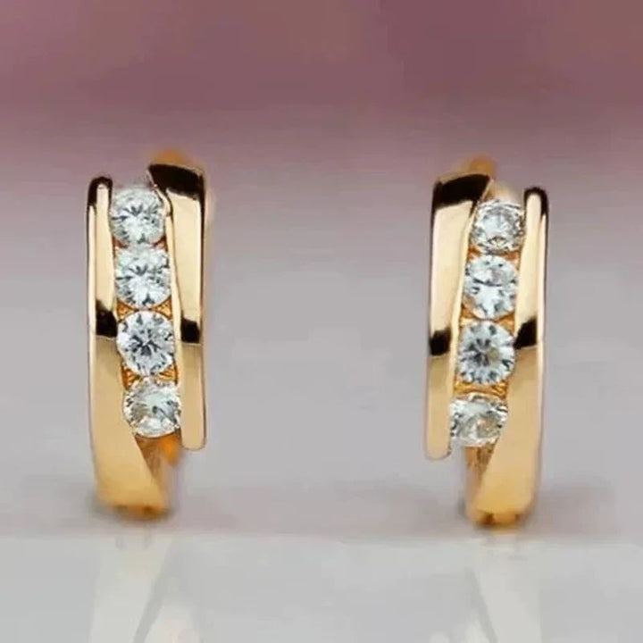 Pendientes elegantes de circonia dorada