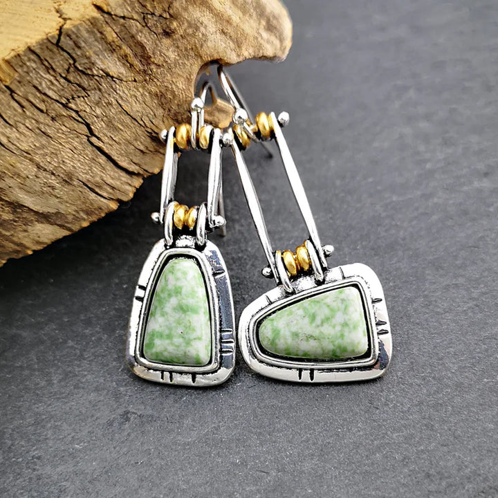 Pendientes colgantes artesanales de plata con turquesa