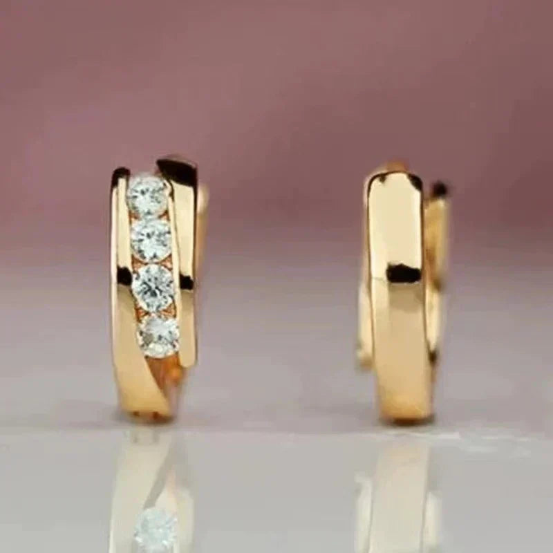 Pendientes elegantes de circonia dorada