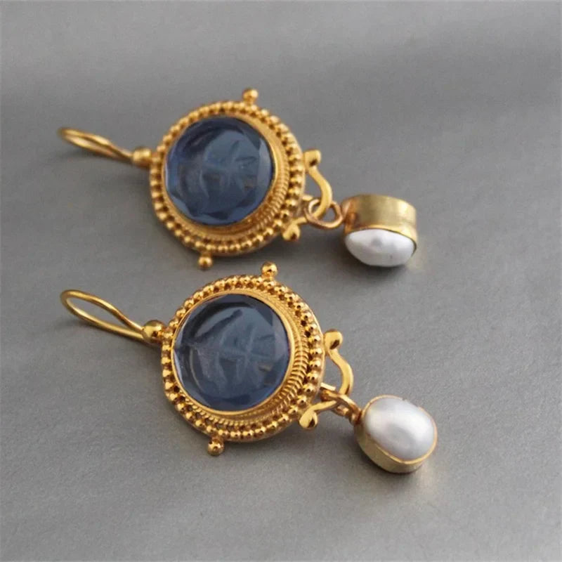Pendientes colgantes de gema azul tallada y perla