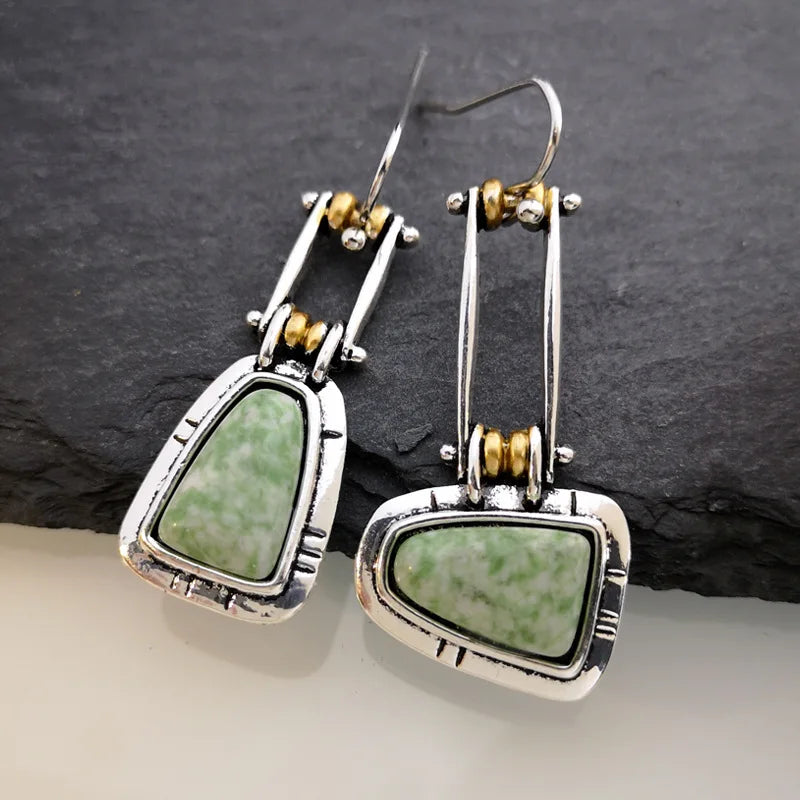 Pendientes colgantes artesanales de plata con turquesa