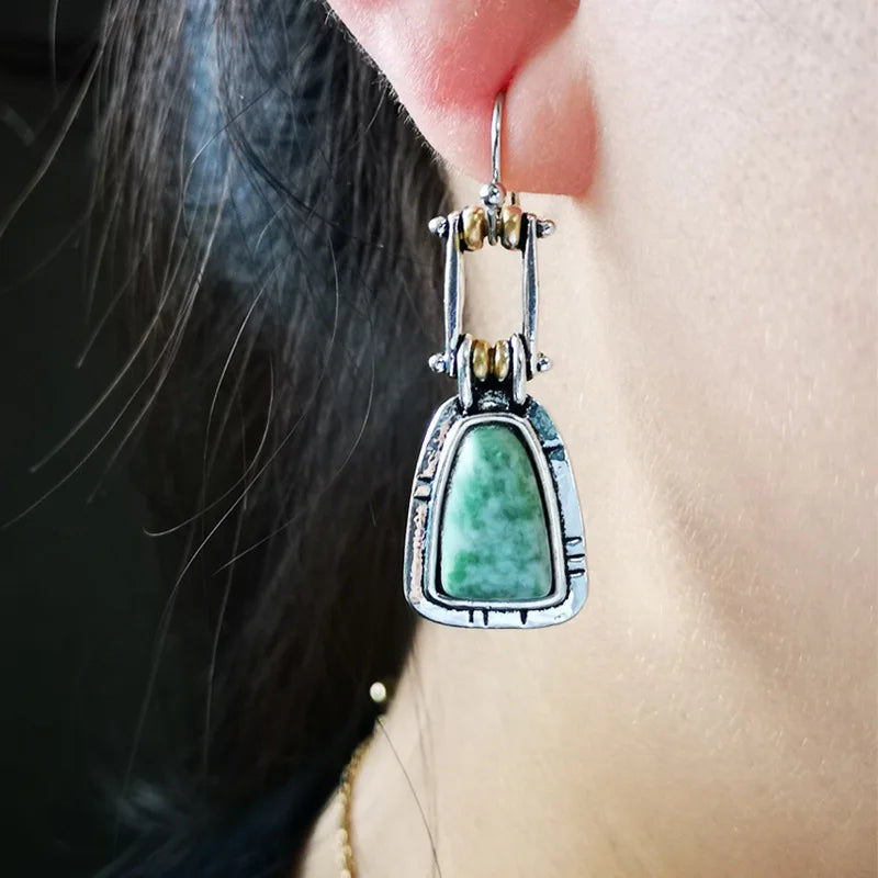 Pendientes colgantes artesanales de plata con turquesa