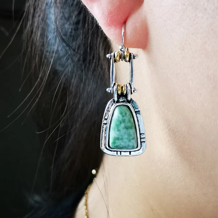 Pendientes colgantes artesanales de plata con turquesa