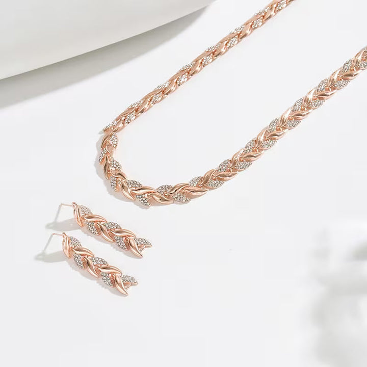Conjunto de pendientes y pulsera con cadena de hojas en oro rosa  