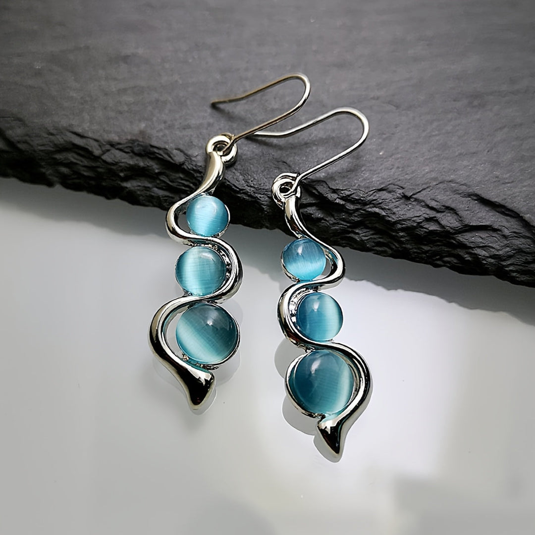 Pendientes colgantes espirales chapados en plata con piedra luna