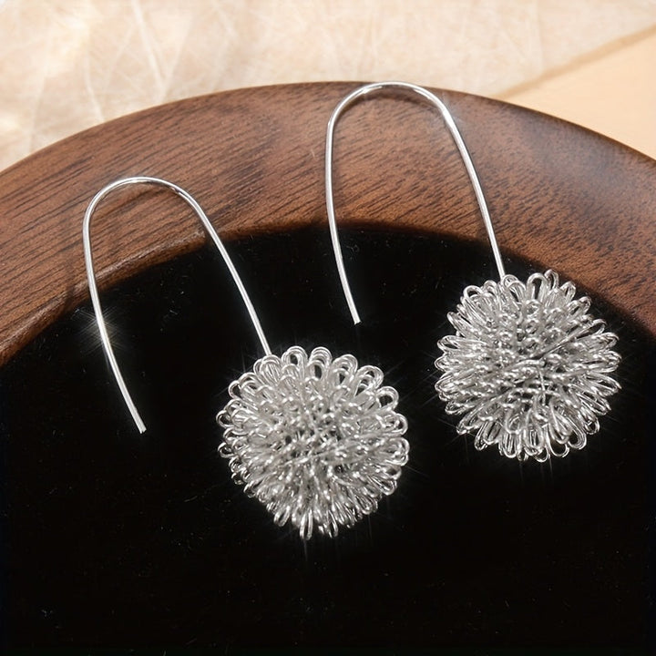Pendientes colgantes artesanales de alambre de plata con flores