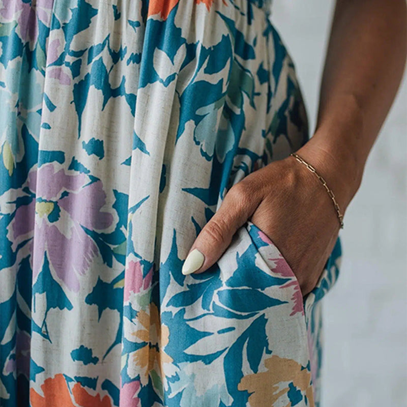 Vestido longo floral com corpete franzido e alças ajustáveis