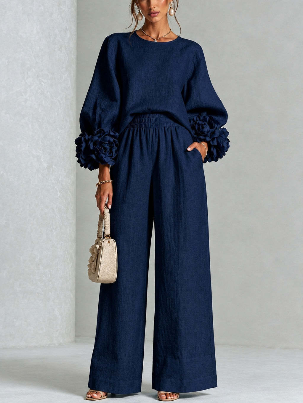 Navy ruffle cuff knit top and wide leg pants, standing front view