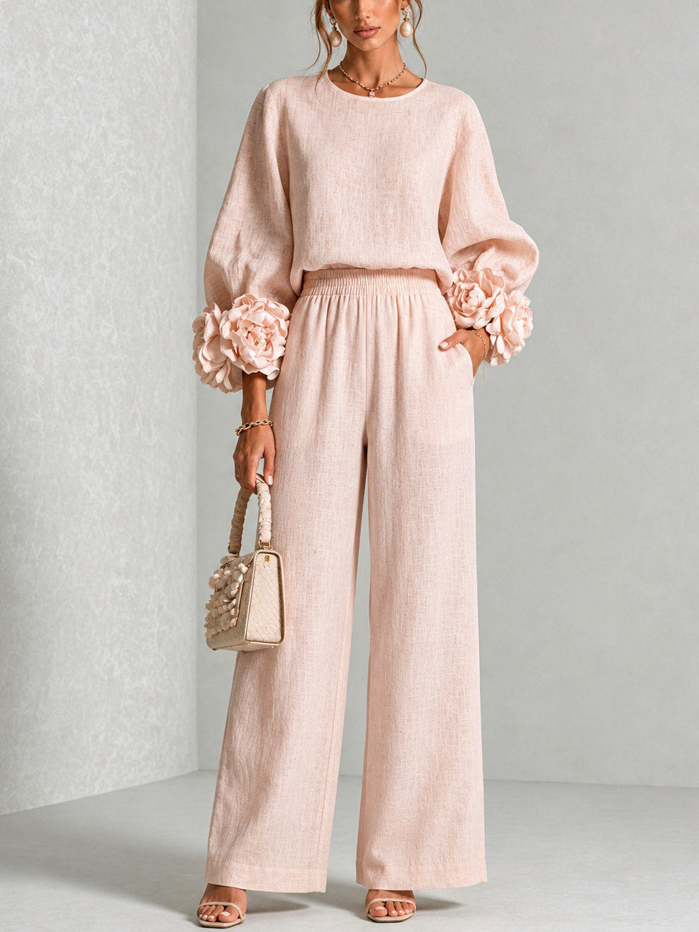 Women's sweater set in pink with ruffle cuff knit top and wide leg pants