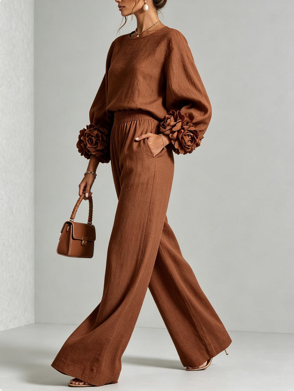 Rust sweater set in a walking pose with a matching brown handbag